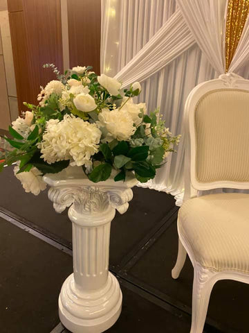 White pillar with real touch flowers