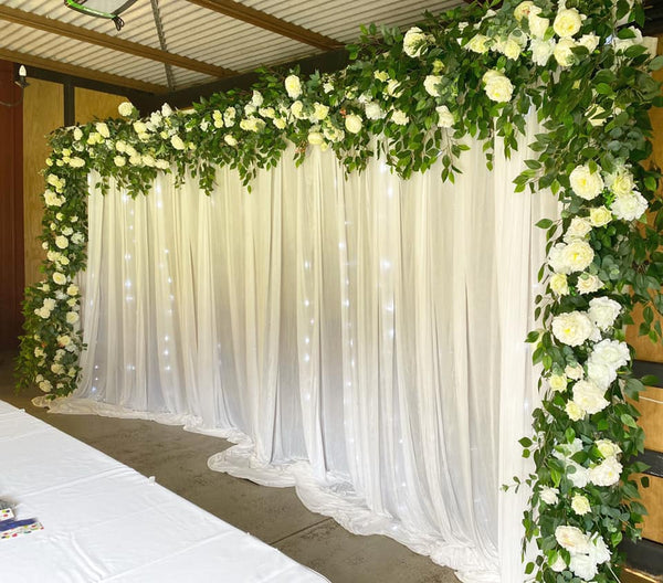 Floral with white curtain backdrop
