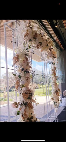 White mental frame & flowers arrangement
